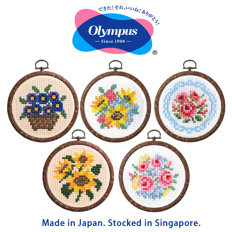 A variety of Olympus Japan beginner cross-stitch kits featuring floral motifs like roses and sunflowers and violets flowers