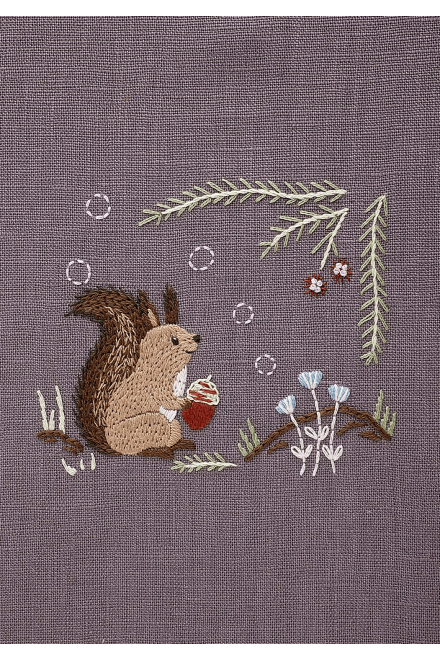 The completed Chicchi animal embroidery featuring a squirrel, showcasing the professional texture and soft, forest-inspired colors