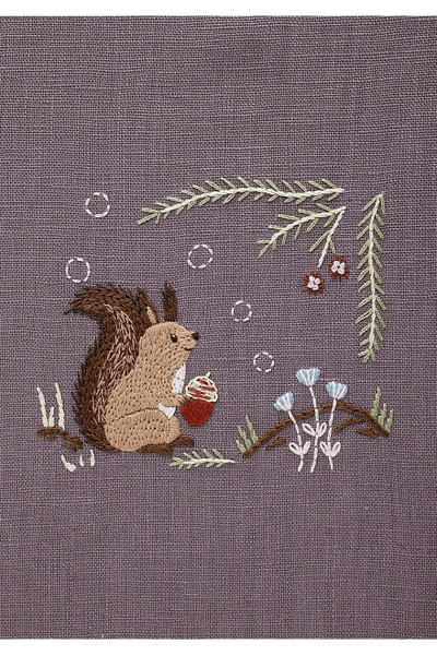 The completed Chicchi animal embroidery featuring a squirrel, showcasing the professional texture and soft, forest-inspired colors