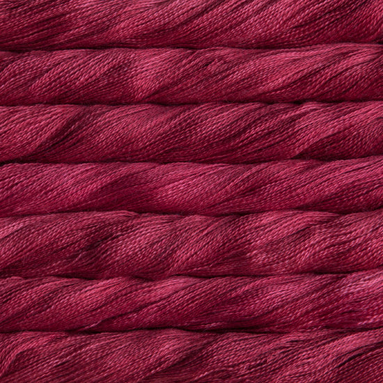 Hand-Dyed Lace Weight Yarn, Luxury Silk Knitting Fiber, Malabrigo Singapore.
A 50g skein of Malabrigo Silpaca yarn, showcasing its signature hand-dyed variegation and the luminous sheen of the silk-alpaca blend in Ravelry Red colour