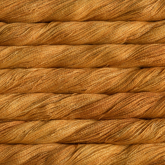 Close-up of the delicate plies of Malabrigo Silpaca, highlighting the subtle, soft halo of baby alpaca fibers and the reflective shimmer of mulberry silk in sunset orange colour