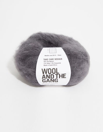 A voluminous 50g ball of Wool and the Gang Take Care Mohair, showing its iconic fluffy halo and soft, radiant fiber texture in Deep grey colour.