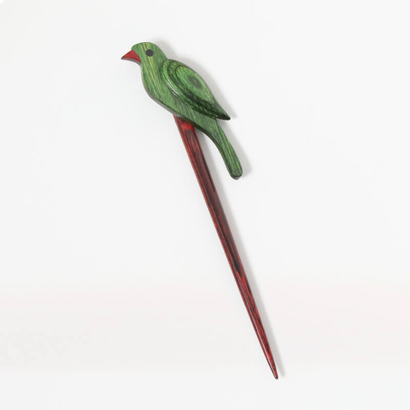 A bright and whimsical Knit Pro shawl stick featuring a 'Chirpy Parrot' motif. The pin is made from high-strength laminated beechwood with vibrant, colorful layers and a smooth, snag-free finish. This one-piece straight pin is designed to secure scarves and shawls or serve as a decorative wooden hair slide.