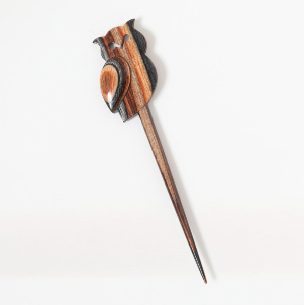 A laminated beechwood shawl stick with an owl design.