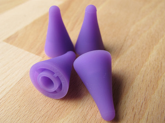 A pair of purple Clover point protectors, Prevent dropped stitches, knitting accessories Singapore, Clover green and purple stoppers, travel knitting tools, silicone needle guards.