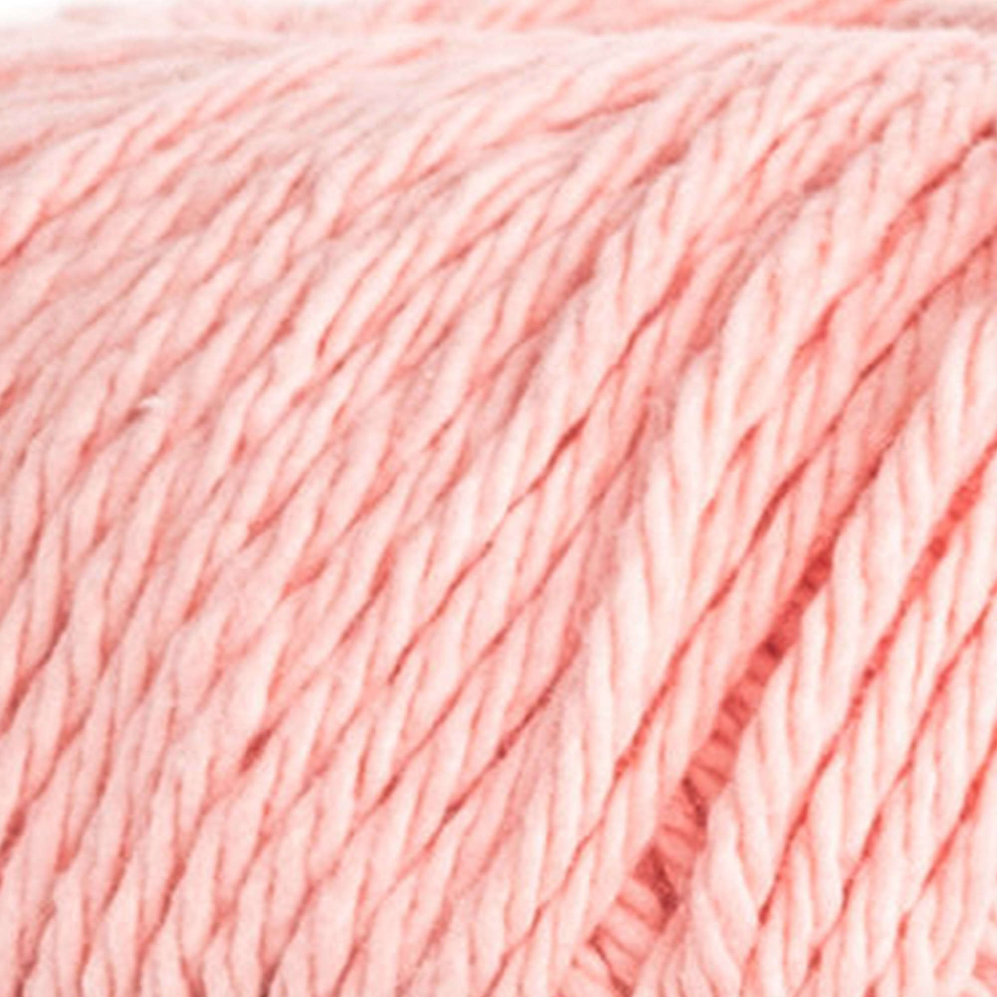 "A skein of Lily Sugar N' Cream 100% cotton yarn in coral rose color. The texture is soft yet sturdy, showing the natural matte finish of the cotton fibers. The packaging clearly displays the Lily brand logo and weight options, ideal for durable kitchen and bathroom DIY projects