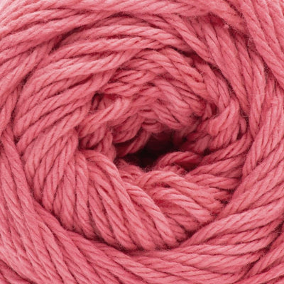 A skein of Lily Sugar N' Cream 100% cotton yarn in pink color. The texture is soft yet sturdy, showing the natural matte finish of the cotton fibers. The packaging clearly displays the Lily brand logo and weight options, ideal for durable kitchen and bathroom DIY projects.