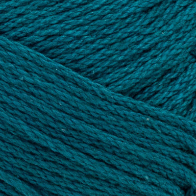 A skein of Lion Brand 24/7 Cotton yarn, highlighting the shiny mercerized finish and tightly plied 100% cotton texture in "dragon-fly" green colour