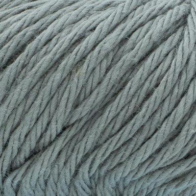 A 100g skein of Lion Brand Pima Cotton yarn showcasing its smooth, matte finish and multi-ply construction. The image highlights the high-quality combed cotton fibers, perfect for creating durable baby blankets, summery garments, and home decor items in a wide range of vibrant and muted colors pewter grey colour