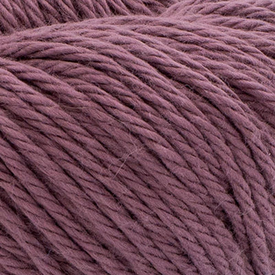 A 100g skein of Lion Brand Pima Cotton yarn showcasing its smooth, matte finish and multi-ply construction. The image highlights the high-quality combed cotton fibers, perfect for creating durable baby blankets, summery garments, and home decor items in a wide range of vibrant and muted colors in rose taupe colour