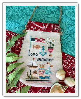 lose-up of the Lizzie Kate mermaid motif stitched on linen, highlighting the delicate golden shell accessory and vibrant DMC colors

Coastal needlework projects, Lizzie Kate Purse Series, beach themed cross stitch, lambswool linen embroidery, boutique craft kits Singapore