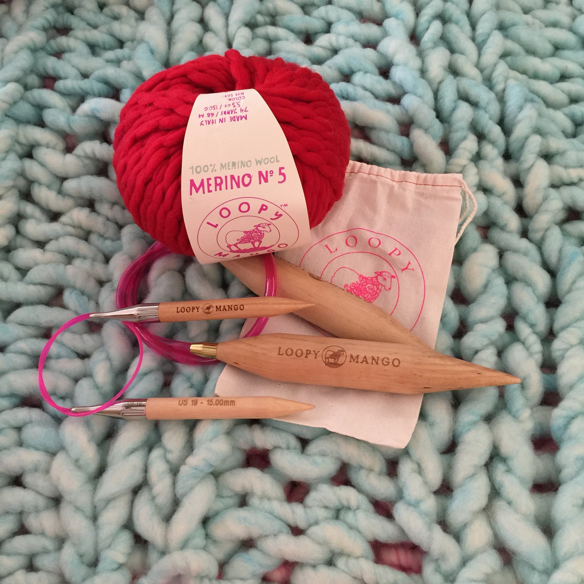 Loopy Mango Gigantic Circular Knitting Needles made of premium birch wood, featuring a thick diameter and flexible cord designed for extreme knitting and oversized chunky yarn projects