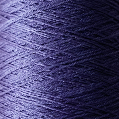The iridescent effect of Pierrot Silk100 yarn, showing how the color changes from deep jewel tones to bright highlights under different lighting in wisteria purple colour