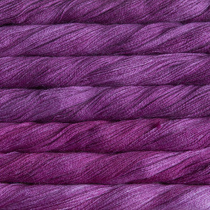 Hand-Dyed Lace Weight Yarn, Luxury Silk Knitting Fiber, Malabrigo Singapore.
A 50g skein of Malabrigo Silpaca yarn, showcasing its signature hand-dyed variegation and the luminous sheen of the silk-alpaca blend in holly hock violet purple colour