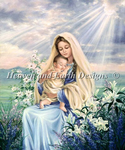 A cross-stitch chart depicting the Madonna lily with a blue and white dress, holding a baby, surrounded by a green garden with flowers.