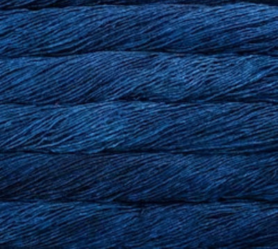 A 50g skein of Malabrigo Silky Merino yarn, featuring a premium 50% silk and 50% merino wool blend in a dk weight for a soft, shimmering finish in Blue