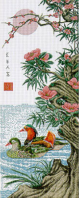 A cross stitch kit depicting a pair of mandarin ducks in a garden setting, with floral elements and a traditional oriental design.