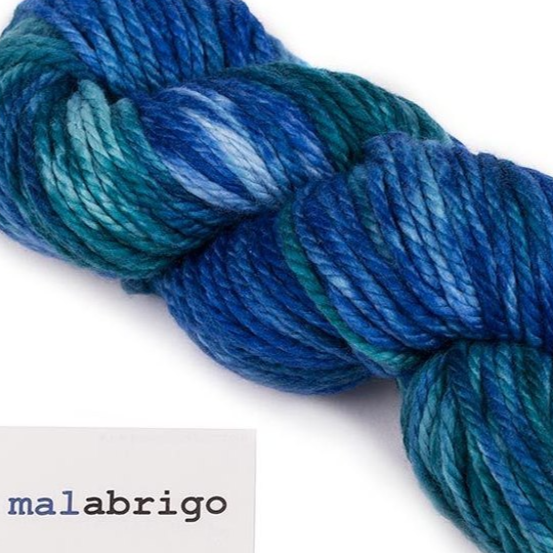 A skein of Malabrigo Chunky Yarn in a variegated blue color pattern.