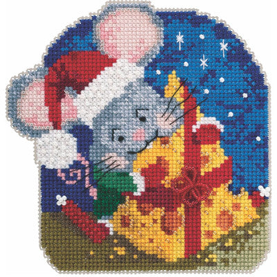 A charming Mill Hill cross-stitch kit featuring a vibrant bowl of macaroni and cheese. The design is worked on 14-count perforated paper and is heavily embellished with signature Mill Hill glass beads to add texture and shine to the cheese sauce. The kit includes all beads, floss, needles, and a 4.75-inch square perforated paper sheet