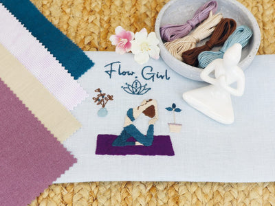 The book is filled with inspiring embroidery and cross-stitch patterns centered around themes of wellness, nature, and inner peace, aimed at providing a relaxing and meditative stitching experience