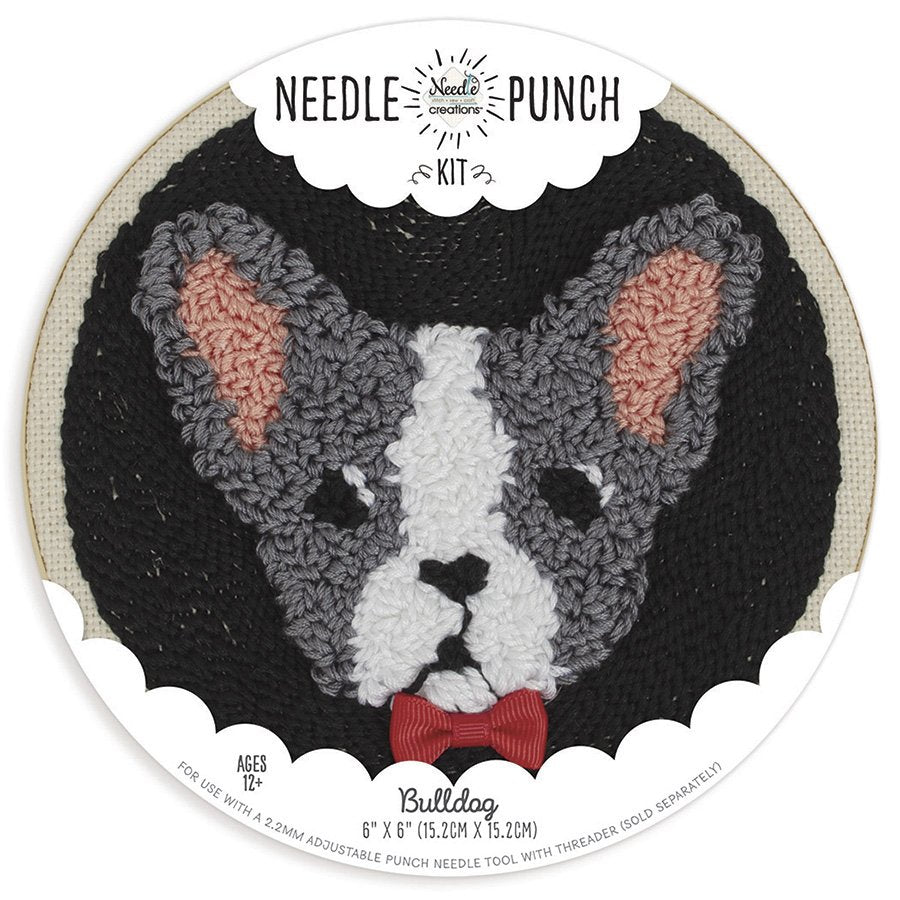 A circular punch needle kit from Needle Creations featuring a whimsical and stylized bulldog design. The design is pre-printed on a 100% polyester fabric panel for a stress-free start. The kit includes a modern palette of embroidery floss, miscellaneous embellishments for added detail, and a 6-inch plastic locking embroidery hoop to keep the fabric perfectly taut. The finished artwork boasts a rich, carpet-like 3D texture