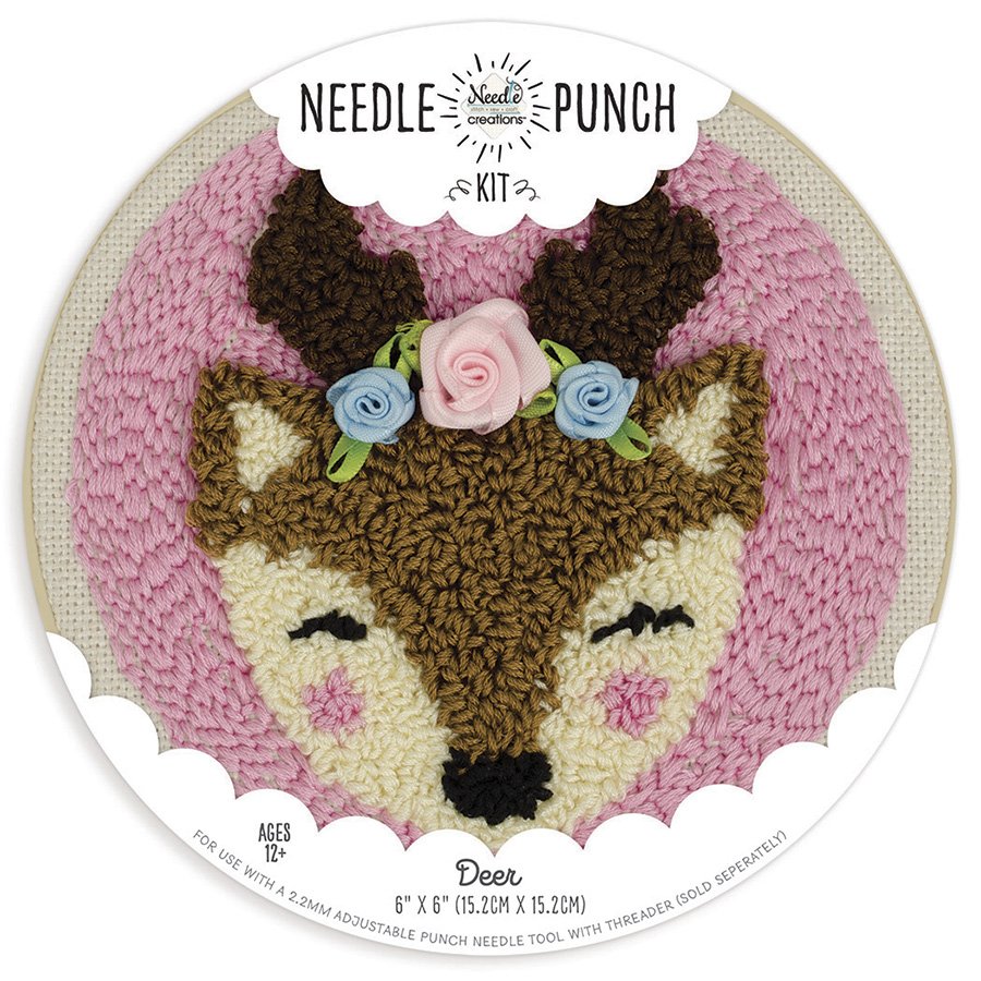 A circular punch needle kit from Needle Creations featuring a stylized, whimsical deer design. The design is pre-printed on a 100% polyester fabric panel for easy stitching. The kit includes earthy tones of embroidery floss, miscellaneous embellishments to add detail, and a 6-inch plastic locking embroidery hoop to maintain perfect fabric tension. The finished artwork features a thick, carpet-like looped texture