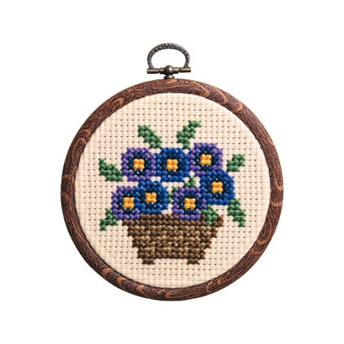 Olympus thread embroidery cross stitch kit with hoop showing violets Pansy flowers,

A display of genuine Olympus Japan embroidery kits in our Singapore brick-and-mortar store, highlighting the authentic packaging