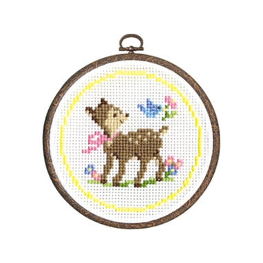 Cross stitch kit depicting a deer and floral design on a circular Aida cloth, in a 6-inch embroidery hoop.
The completed Deer in the Forest project framed in its 6-inch hoop, displayed as a charming piece of handmade wall art
