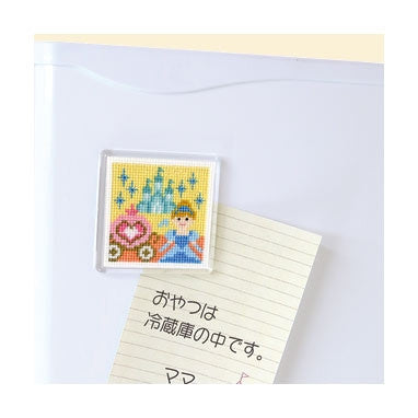 A cross stitch magnet featuring fairy tale characters Cinderella and Snow White with a bird, a tree, and flowers.
Olympus Fairytale Magnet! The ultimate boutique gift. Japanese quality and iconic storybook scenes make this "Kawaii" kit a hit for every new maker.