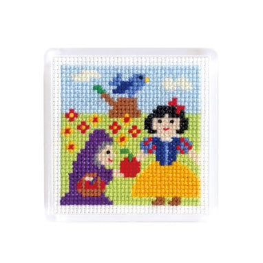 A cross stitch magnet featuring fairy tale characters Cinderella and Snow White with a bird, a tree, and flowers.
