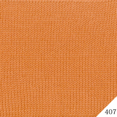 Close-up of the Tree House Palace fibers, highlighting the clean plies and the smooth finish of the Uruguay merino blend in orange colour