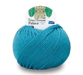A ball of Olympus Tree House Palace yarn in blue color with a label showing the brand and product name.