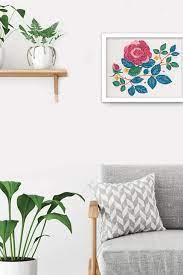A close-up of a delicate flora design from the Indoor Garden collection, showing the painterly shading and fine stitch details