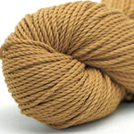 A collection of colorful Pierrot Yarn Ami Cotton Bulky yarn skeins in Biscuit Brown Colour, arranged in a row, showcasing a variety of colors suitable for knitting and crochet projects.