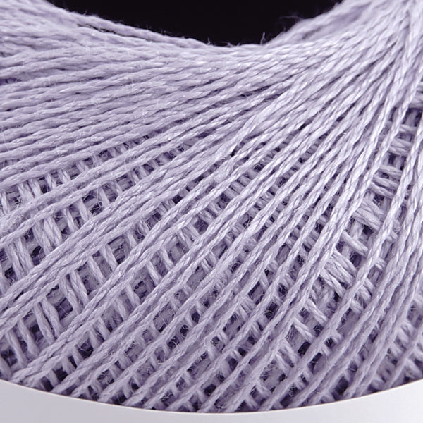 A 40g ball of Pierrot Chanvre, a 100% linen yarn made in Japan, showing its smooth, natural fiber texture and slight lustrous sheen in lavender colour