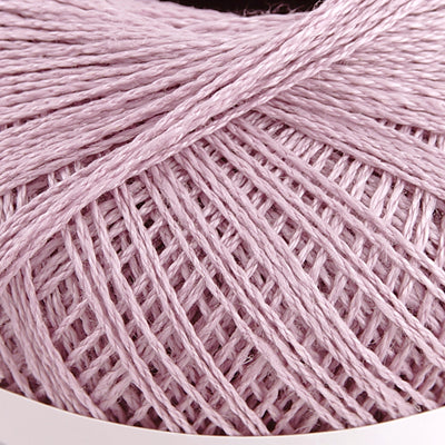 Pierrot brand 100% linen yarn in various colors, displayed in round spools with Japanese text indicating the material and origin in mauve pink