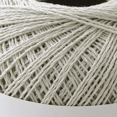 A 40g ball of Pierrot Chanvre, a 100% linen yarn made in Japan, showing its smooth, natural fiber texture and slight lustrous sheen in mist grey