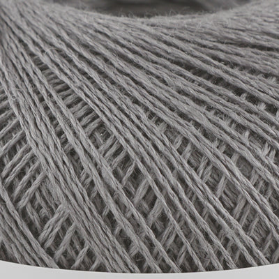 A 40g ball of Pierrot Chanvre, a 100% linen yarn made in Japan, showing its smooth, natural fiber texture and slight lustrous sheen in slate grey
