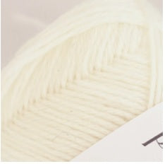 A 40g skein of Pierrot Pure Wool, 100% wool yarn made in Japan, featuring a smooth, balanced twist for knitting and crochet in cream colour
