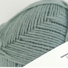 A 40g skein of Pierrot Pure Wool, 100% wool yarn made in Japan, featuring a smooth, balanced twist for knitting and crochet in sage green colour