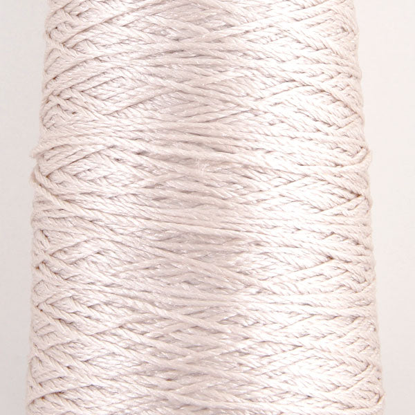 A 100% pure silk fingering weight yarn from Pierrot, made in Japan, featuring a smooth, high-luster finish and a delicate ply for lightweight knitting and crochet. in shell pink