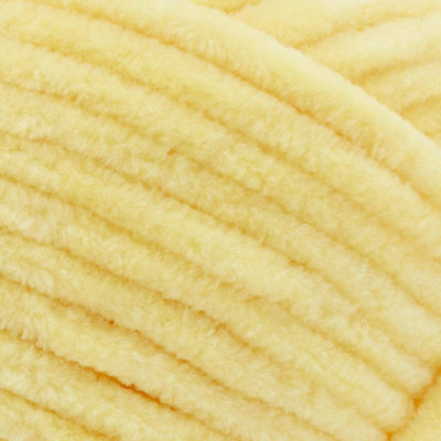 Soft Premier Parfait Chunky yarn in a large skein, showing the thick, velvety chenille texture in Sunshine yellow