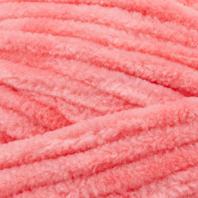 A soft, bulky weight Premier Parfait Chunky yarn perfect for making amigurumi and plush home decor in coral pink colour