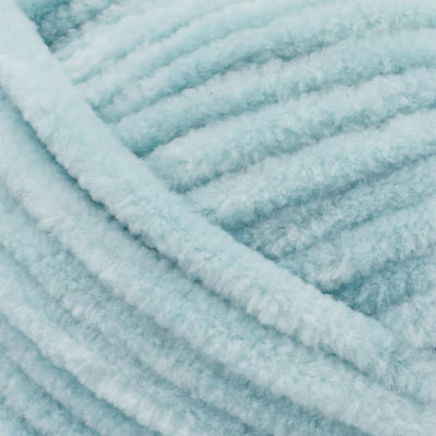 Soft Premier Parfait Chunky yarn in a large skein, showing the thick, velvety chenille texture in Rain green colour