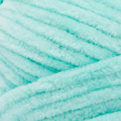 Close-up of Premier Parfait Chunky polyester yarn, highlighting the dense, plush pile and vibrant color in sea glass green colour