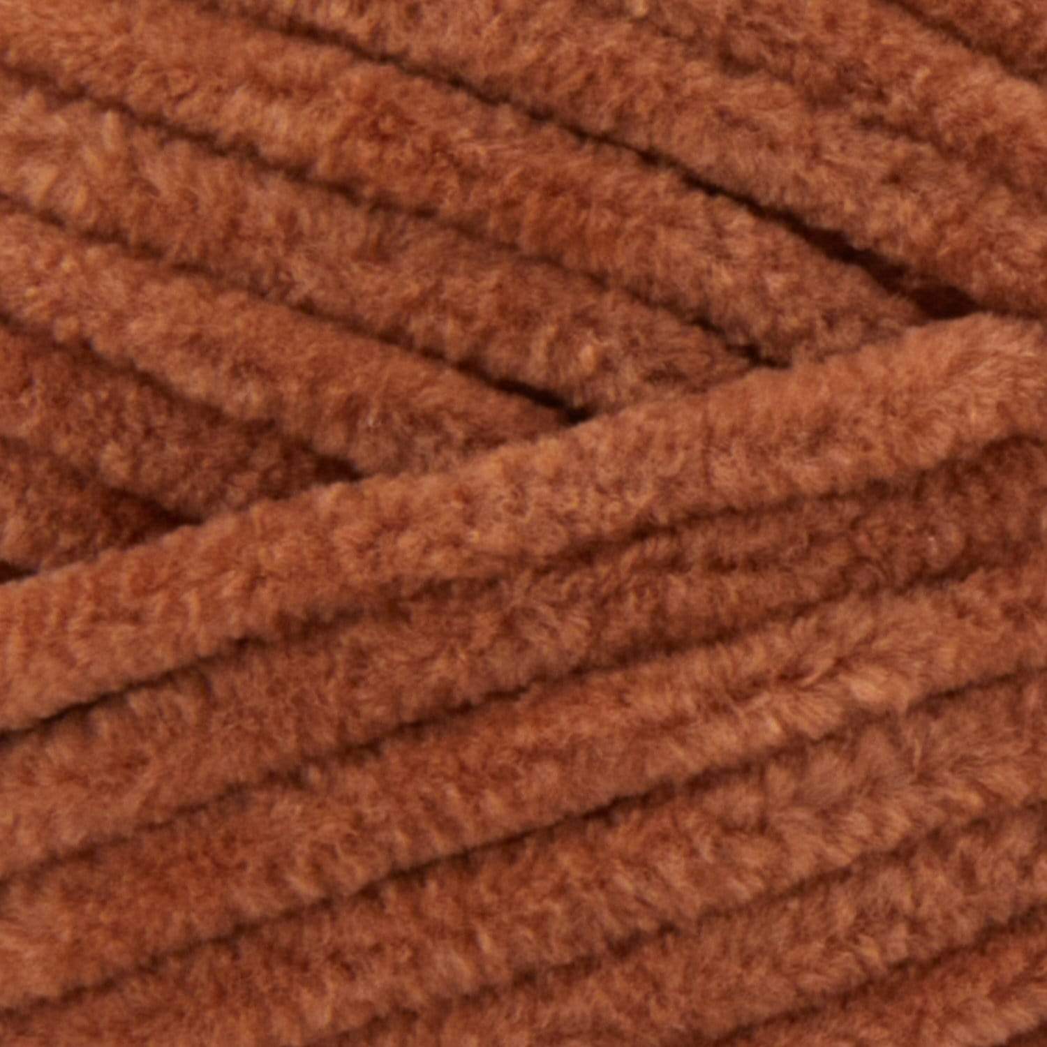 A fluffy skein of Premier Parfait Chunky yarn with a slight sheen, demonstrating its thick, rounded strand in teddy bear brown colour