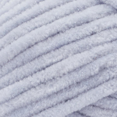 Close-up of Premier Parfait Chunky polyester yarn, highlighting the dense, plush pile and vibrant color in cloudy day grey colour