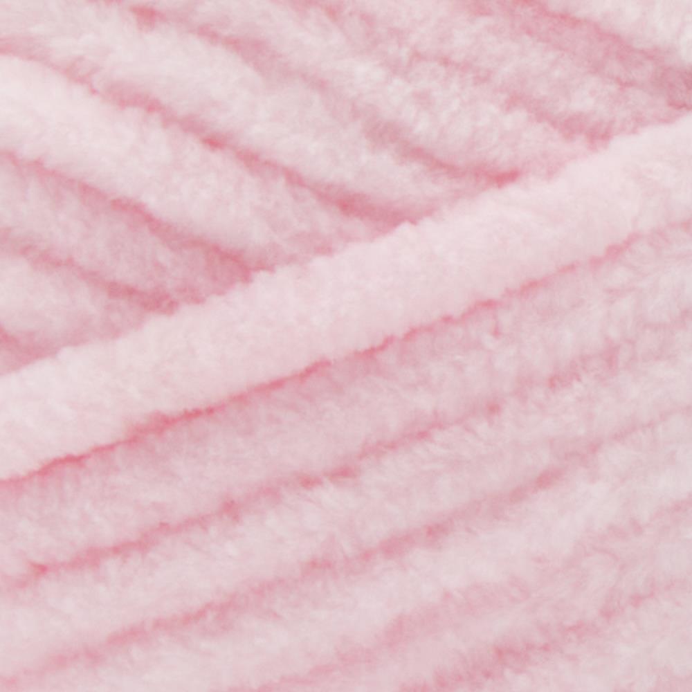 Close-up of Premier Parfait Chunky polyester yarn, highlighting the dense, plush pile and vibrant color in cotton candy pink colour