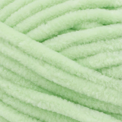 Close-up of Premier Parfait Chunky polyester yarn, highlighting the dense, plush pile and vibrant color in mint colour