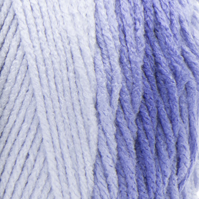 A large 283-gram skein of Red Heart Super Saver Ombre yarn, showing a beautiful gradient transition from a light tint to a deep, saturated shade Blue color. The yarn has a classic 4-ply twist and a soft matte finish, perfect for creating shawls, blankets, and garments with a natural ombré effect